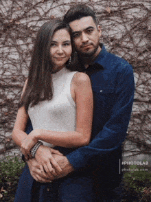 a man and woman posing for a photo with the hashtag #photolab.com