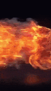 a fireball is flying through the air with a black background