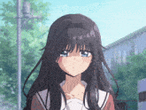 a girl with long black hair and blue eyes is looking at the camera
