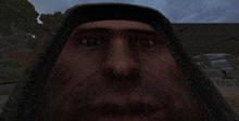 a close up of a man 's face with a dark background