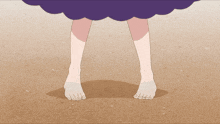 a person in a purple dress is standing on a sandy surface