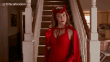 a woman in a scarlet witch costume stands in front of a staircase