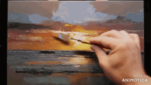 a painting is being painted on a canvas with the words made in animotica on the bottom