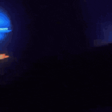a blurry picture of a blue and orange light