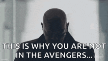 a bald man is standing in front of a window and says `` this is why you are not in the avengers ... '' .