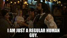 a man in a suit and tie says i am just a regular human guy ..