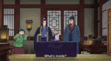 a group of people standing around a table with the words what 's inside on the bottom