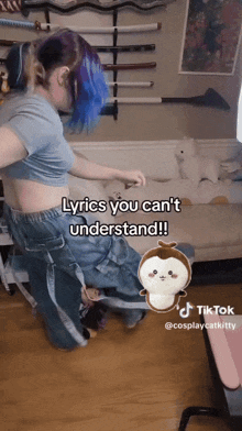 a woman with blue hair is standing in front of a couch with lyrics you can 't understand on it
