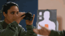 Watching With Night Vision Goggles Michelle Khare GIF - Watching With Night Vision Goggles Michelle Khare Inspecting GIFs