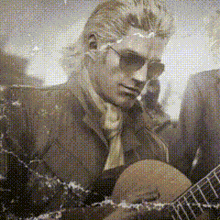 a man in a suit is playing a guitar