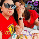 two women sitting at a table with a sign that says i love you so much italian love