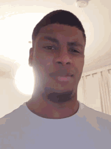 a close up of a man 's face with a light shining on it