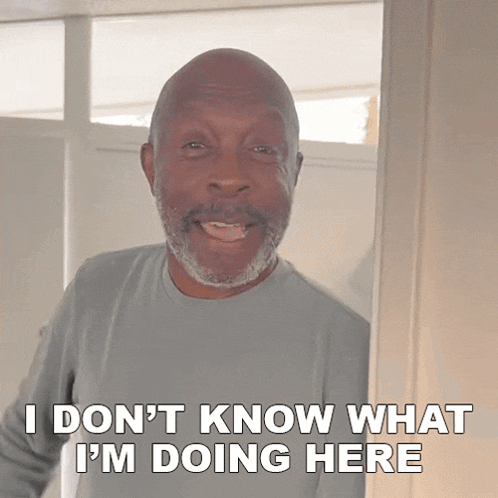 a man standing in a doorway with the words i don t know what i 'm doing here