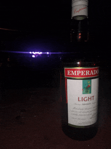 a bottle of emperado light brandy is sitting on a table
