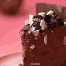 a close up of a piece of chocolate cake with the words mr.cakes written below it