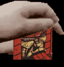 a pixelated image of a person holding a red box