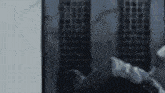 a blurred image of a person standing in front of a building