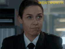 a close up of a woman 's face with the word wentworth in the corner