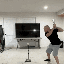 a man swinging a bat in front of a flat screen tv that says ' netflix ' on it