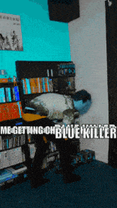 a man in a zombie costume is standing in front of a bookshelf with the words " megettingchblue killer " on the bottom