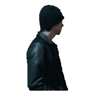a man wearing a black beanie and a leather jacket looks surprised