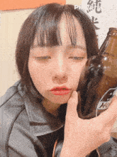 a girl is holding a bottle of beer in front of her face with pixverse.ai written on the bottom