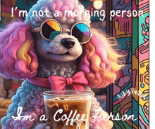 a poodle wearing sunglasses and a pink bow tie holds a glass of coffee