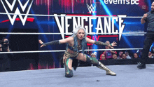 a woman in a wrestling ring with the words vengeance on the ring