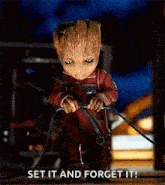 a baby groot from guardians of the galaxy is holding a sword and saying `` set it and forget it! ''