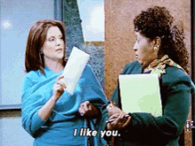 two women standing next to each other and one of them says i like you