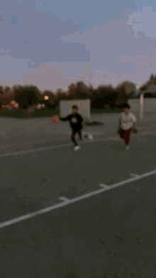 a basketball is going through a basketball hoop in the air
