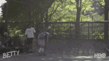 a person riding a skateboard on a ramp with betty written on it
