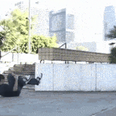 a person is laying on the ground with their legs up in the air