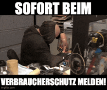a man sitting at a desk with the words sofort beim written on the bottom