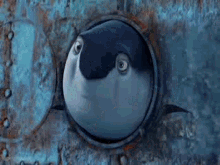 a person is looking through a hole in a wall .