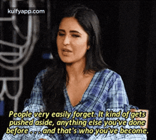 a woman in a plaid shirt is talking to someone and says `` people very easily forget .