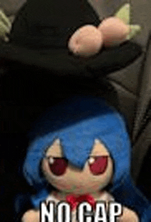 a stuffed doll with blue hair and red eyes is wearing a hat and a bow .