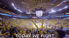 a crowd of people watching a basketball game in a stadium with the words `` today we fight '' written on it .
