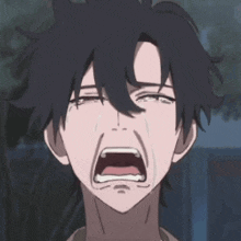 a man is crying with his mouth open