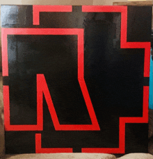 the letter n is painted on a black background