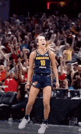 a female basketball player wearing a number 10 jersey