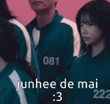 a girl is standing next to a man and the words junhee de mai 223 are on the bottom