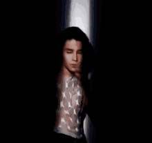 a blurry picture of a man in a white shirt