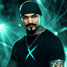 a man with a beard is wearing a black shirt with a blue x on it