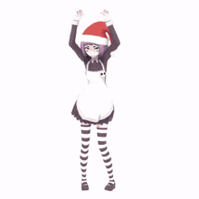 a girl wearing a santa hat and striped socks is dancing
