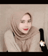 a woman wearing a hijab with the words as salaamu alay kanna on the bottom right