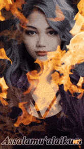 a woman is surrounded by flames and the words " asalamu 'alaikum "