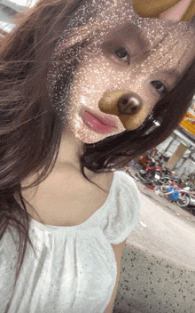 a woman wearing a snapchat filter with a dog nose