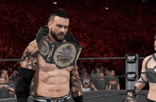 a man in a wrestling ring is wearing a belt that says ' madman ' on it