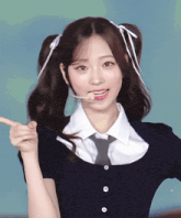 a girl with pigtails is wearing a tie and a shirt